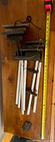 Full view of wind chime with tape measure showing length
