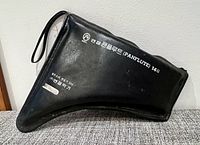 Black faux-leather pan flute case with Korean/English text and strap