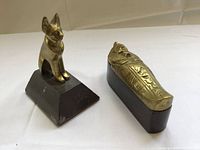 Brass cat on stone and sarcophagus box showing scale and condition
