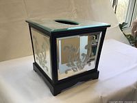 front and side view showing etched mirror panels and wood frame