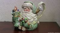 Front view of Fitz and Floyd Santa teapot showing overall form and decoration