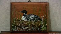 Front view of entire loon painting on wood board