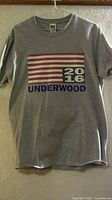 Front view of grey Underwood 2016 t-shirt showing full graphic and tag