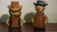 Front view of both ceramic hillbilly shakers