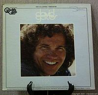 Front gatefold cover showing portrait and QuadraDisc logo