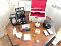 Overview of assorted jewelry boxes on table