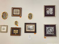 Wall view showing all nine framed pieces in situ