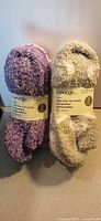 Two bundled sets of George cozy low cut socks, purple and grey colourways with labels visible