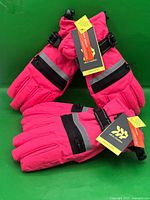 Two pairs of pink All In Motion kids snow gloves with tags displayed