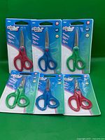 Six retail-packaged School Works kids scissors displayed front