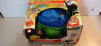 Front view of boxed push ’n’ bubble mower toy