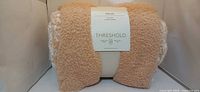 Rolled Threshold throw showing front label and texture