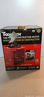 Front of boxed Tooltech fan-forced construction heater showing model image and ratings
