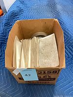 Top view of box showing papers and film reel