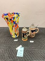 Group shot of vase and two steins with measurement tags
