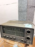 Front view of Lafayette HE-30 receiver showing tuning scale, knobs, and wear