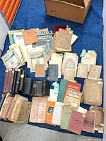 Overhead view showing majority of books, magazines and pamphlets spread out