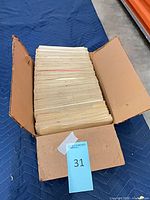 Closed cardboard box containing upright paper records