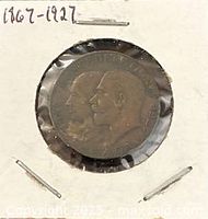 Obverse of bronze medal in flip showing conjoined busts and dates