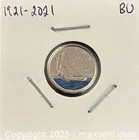 Reverse of coin showing colorized Bluenose schooner