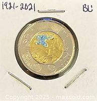 Reverse side of 2021 colour $2 insulin coin in holder
