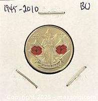 Obverse showing colourized poppy design and 1945-2010 date in 2×2 flip