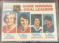 Front of 1977-78 O-Pee-Chee NHL #69 Game Winning Goal Leaders card showing four player images