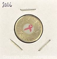 Reverse showing pink ribbon design and denomination inside flip