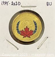 Reverse of 2020 colour $1 coin showing maple leaf and laurel design
