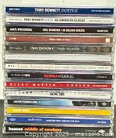 Full stack of 14 CD spines visible