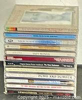 Stack of 12 soundtrack CDs in jewel cases