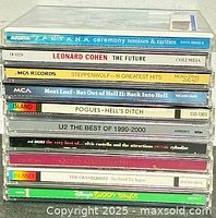 Full stack of ten CDs showing titles and spines