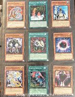 Front view of all nine Yu-Gi-Oh! cards in binder sleeve