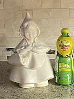 Cookie jar assembled beside lemon juice bottle for scale