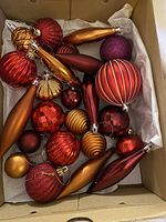 Box of assorted red, gold and bronze ball and teardrop ornaments