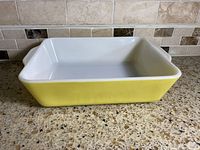 Side view showing yellow exterior and handles