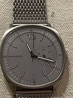 Front view of Skagen watch showing dial, hands, markers, small seconds subdial