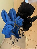 Both folded chairs, blue and black