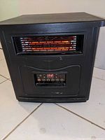 Front view showing glowing heating elements and control panel