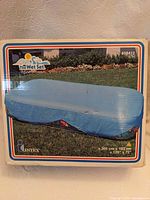 Front of boxed Intex pool cover showing product image