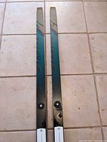 Full view of both skis showing length and graphics