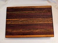 Top view of striped hardwood cutting board