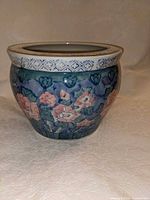 front view of ceramic floral planter showing exterior design