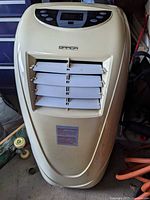 Front view of Brada portable air conditioner showing louvered vent and yellowed shell