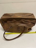 Full view of duffel showing handles and tape measure for length