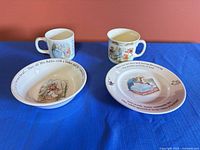 All four pieces: plate, bowl, two cups