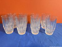 Front view of eight crystal highball glasses