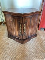 Front view of hexagonal wood side table closed