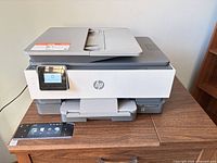 Front view showing HP OfficeJet 8015e printer on table