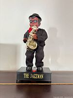 Front view of animated Jazzman figurine showing full outfit and saxophone
